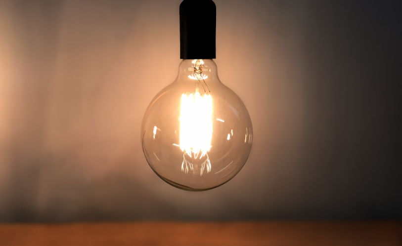 Close view of evenly spaced warm-white LED bulbs along a Michigan eave line